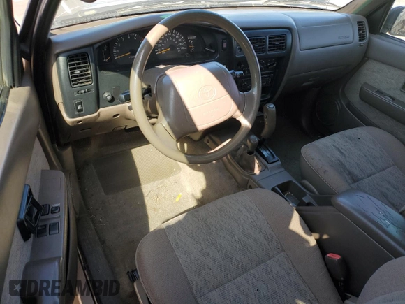 1999 Toyota Tacoma z VIN 4TAWN72N5XZ418522, wystawiony jako Copart lot #51940615 z przebiegiem 340 432 mil mil oraz Szkoda całkowita • Salvage title. Historia ofert i sprzedaży dostępna na DreamBid. Obrazek 8.