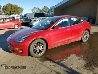 2018 Tesla Model 3 Long Range Battery with VIN 5YJ3E1EAXJF047285, listed as a Copart auction lot 87875175 with 114,896 mi miles and Salvage Title. Bid and sale history available at DreamBid. Image 1.