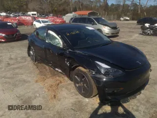 2022 Tesla Model 3 Long Range with VIN 5YJ3E1EB3NF334059, listed as a IAAI auction lot 41591962 with 36,523 mi miles. Bid and sale history available at carsss.com. Image 1.