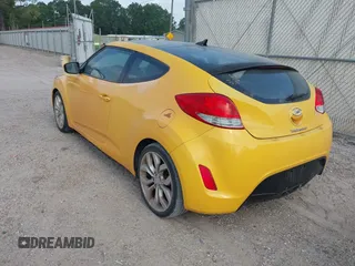 2012 Hyundai Veloster w/Gray Int z VIN KMHTC6AD7CU026855, wystawiony jako IAAI lot #42253694 z przebiegiem 119 802 mil mil oraz . Historia ofert i sprzedaży dostępna na DreamBid. Obrazek 3.
