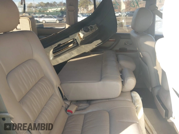 1999 Lexus LX 470 z VIN JT6HT00W9X0031151, wystawiony jako IAAI lot #41436144 z przebiegiem Nie podano mil oraz . Historia ofert i sprzedaży dostępna na DreamBid. Obrazek 8.