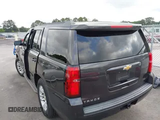 2015 Chevrolet Tahoe LS with VIN 1GNSCAKC0FR245826, listed as a IAAI auction lot 42282590 with 164,208 mi miles and . Bid and sale history available at DreamBid. Image 3.