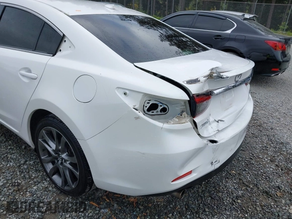 2017 Mazda 6 Grand Touring with VIN JM1GL1X51H1142473, listed as a IAAI auction lot 42234809 with 101,633 mi miles and . Bid and sale history available at DreamBid. Image 6.
