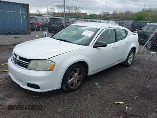 2014 Dodge Avenger SE with VIN 1C3CDZAGXEN221329, listed as a IAAI auction lot 41931109 with 149,715 mi miles. Bid and sale history available at carsss.com. Image 2.