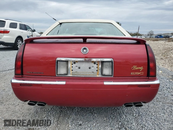 2001 Cadillac Eldorado ESC z VIN 1G6EL12Y11B103541, wystawiony jako Copart lot #45219055 z przebiegiem 46 179 mil mil oraz Tytuł czysty. Historia ofert i sprzedaży dostępna na DreamBid. Obrazek 6.