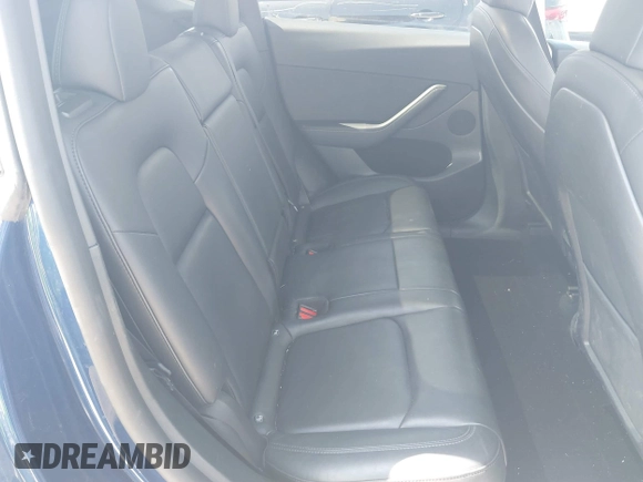 2023 Tesla Model Y Performance with VIN 7SAYGDEF9PF582908, listed as a IAAI auction lot 41930957 with 52,857 mi miles and . Bid and sale history available at DreamBid. Image 8.