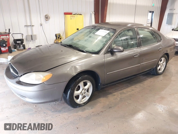 2003 Ford Taurus SE Standard z VIN 1FAFP53UX3G167579, wystawiony jako IAAI lot #42140606 z przebiegiem 178 147 mil mil oraz . Historia ofert i sprzedaży dostępna na DreamBid. Obrazek 2.