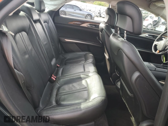 2014 Lincoln MKZ z VIN 3LN6L2GK6ER806741, wystawiony jako Copart lot #57455755 z przebiegiem 96 849 mil mil oraz Szkoda całkowita • Salvage title. Historia ofert i sprzedaży dostępna na DreamBid. Obrazek 10.