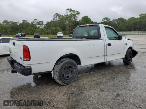 2002 Ford F-150 XL with VIN 1FTRF17W32NB86385, listed as a Copart auction lot 73276754 with 100,817 mi miles and Salvage Title. Bid and sale history available at carsss.com. Image 3.