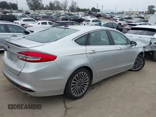 2017 Ford Fusion Hybrid Titanium z VIN 3FA6P0RU7HR300311, wystawiony jako IAAI lot #42045664 z przebiegiem 136 231 mil mil oraz . Historia ofert i sprzedaży dostępna na DreamBid. Obrazek 4.