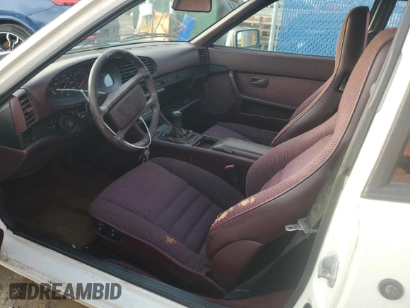 1987 Porsche 944 z VIN WP0AB0948HN473051, wystawiony jako Copart lot #73666654 z przebiegiem 82 580 mil mil oraz Szkoda całkowita • Salvage title. Historia ofert i sprzedaży dostępna na DreamBid. Obrazek 8.