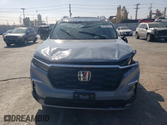 2023 Honda Pilot Touring with VIN 5FNYG2H7XPB011420, listed as a Copart auction lot 69799314 with 9,601 mi miles and Salvage Title. Bid and sale history available at DreamBid. Image 5.