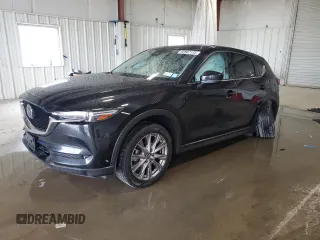 2019 Mazda CX-5 Grand Touring with VIN JM3KFBDM6K0690881, listed as a Copart auction lot 60962135 with 90,678 mi miles and Salvage title. Bid and sale history available at DreamBid. Image 1.