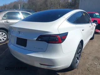 2020 Tesla Model 3 Long Range with VIN 5YJ3E1EBXLF636963, listed as a IAAI auction lot 41826249 with 68,085 mi miles. Bid and sale history available at carsss.com. Image 4.