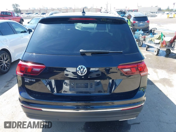 2021 Volkswagen Tiguan SE with VIN 3VV3B7AX1MM045478, listed as a IAAI auction lot 41947899 with 56,694 mi miles and . Bid and sale history available at DreamBid. Image 16.