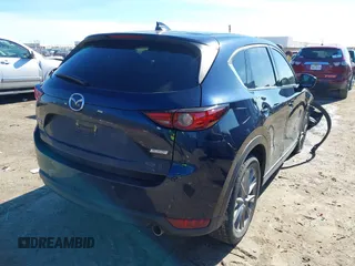 2019 Mazda CX-5 Grand Touring with VIN JM3KFBDM2K1685168, listed as a IAAI auction lot 41323598 with 88,429 mi miles. Bid and sale history available at carsss.com. Image 4.