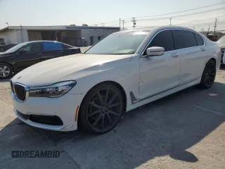 2017 BMW 7 Series 740i xDrive with VIN WBA7E4C59HGU99458, listed as a Copart auction lot 65413575 with 80,859 mi miles and Salvage title. Bid and sale history available at DreamBid. Image 1.