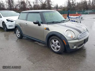 2010 MINI Cooper Hardtop with VIN WMWMF3C58ATZ24045, listed as a IAAI auction lot 41871593 with 150,669 mi miles. Bid and sale history available at carsss.com. Image 1.