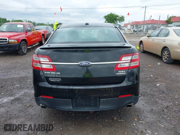 2015 Ford Taurus SEL z VIN 1FAHP2E81FG116032, wystawiony jako IAAI lot #42188269 z przebiegiem 178 774 mil mil oraz . Historia ofert i sprzedaży dostępna na DreamBid. Obrazek 16.