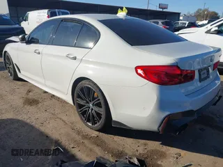 2018 BMW 5 Series M550i xDrive with VIN WBAJB9C54JB050218, listed as a IAAI auction lot 41132695 with 69,659 mi miles. Bid and sale history available at carsss.com. Image 3.