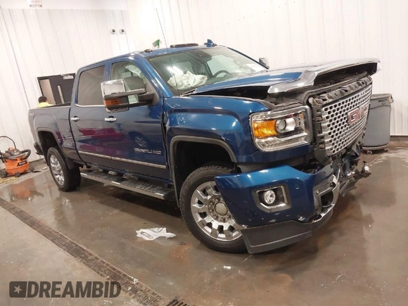 2015 GMC Sierra 2500HD Denali z VIN 1GT120E86FF655301, wystawiony jako IAAI lot #41965001 z przebiegiem 74 136 mil mil oraz . Historia ofert i sprzedaży dostępna na DreamBid. Obrazek 1.