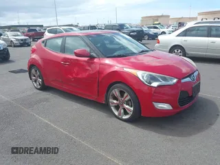 2013 Hyundai Veloster w/Red Int with VIN KMHTC6AD5DU172902, listed as a IAAI auction lot 42750738 with 86,558 mi miles and . Bid and sale history available at DreamBid. Image 1.