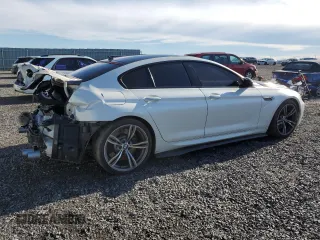 2017 BMW M6 z VIN WBS6E9C56HG437410, wystawiony jako Copart lot #80217694 z przebiegiem 68 335 mil mil oraz Szkoda całkowita • Salvage title. Historia ofert i sprzedaży dostępna na DreamBid. Obrazek 3.