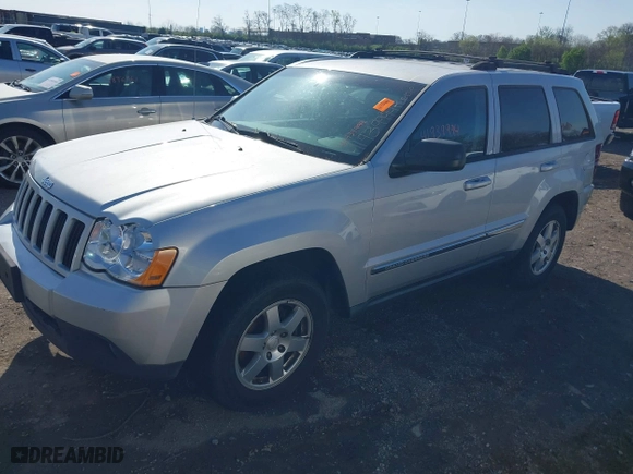 2010 Jeep Grand Cherokee Laredo with VIN 1J4PR4GK5AC161442, listed as a IAAI auction lot 41939994 with 137,376 mi miles. Bid and sale history available at carsss.com. Image 2.