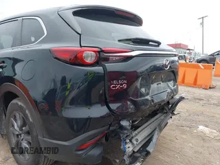 2021 Mazda CX-9 Sport with VIN JM3TCABY6M0522352, listed as a IAAI auction lot 42613136 with 106,167 mi miles and . Bid and sale history available at DreamBid. Image 6.