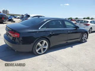2018 Audi A8 z VIN WAU44AFD0JN000880, wystawiony jako Copart lot #54751235 z przebiegiem 76 161 mil mil oraz Szkody całkowita. Historia ofert i sprzedaży dostępna na DreamBid. Obrazek 3.