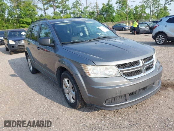2013 Dodge Journey SE z VIN 3C4PDCAB5DT518019, wystawiony jako IAAI lot #42409340 z przebiegiem 174 339 mil mil oraz . Historia ofert i sprzedaży dostępna na DreamBid. Obrazek 1.