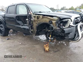 2015 Toyota Tacoma with VIN 3TMLU4EN9FM181683, listed as a IAAI auction lot 41980940 with 176,523 mi miles and . Bid and sale history available at DreamBid. Image 6.
