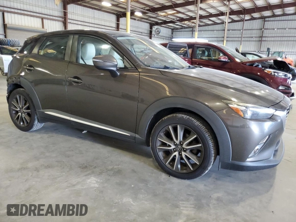 2017 Mazda CX-3 Grand Touring z VIN JM1DKFD74H0163736, wystawiony jako Copart lot #57871265 z przebiegiem 212 515 mil mil oraz Szkody całkowita. Historia ofert i sprzedaży dostępna na DreamBid. Obrazek 4.