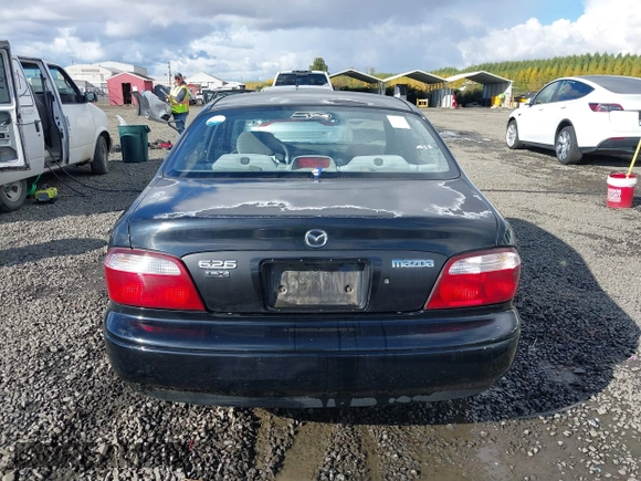 2000 Mazda 626 LX z VIN 1YVGF22CXY5123930, wystawiony jako IAAI lot #40712369 z przebiegiem 210 234 mil mil oraz . Historia ofert i sprzedaży dostępna na DreamBid. Obrazek 16.