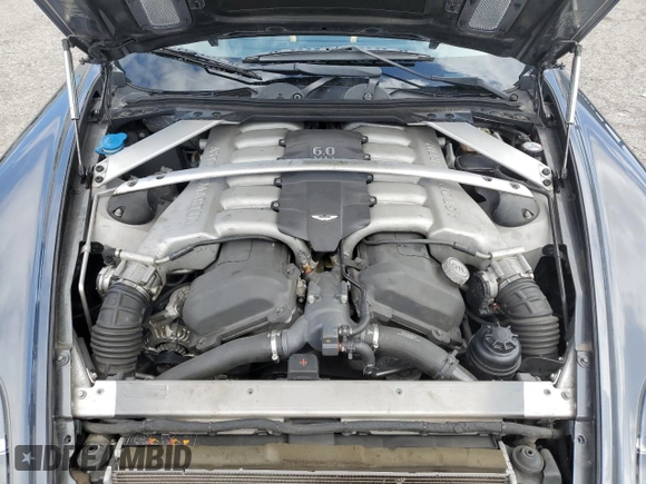 2007 Aston Martin DB9 z VIN SCFAD01A77GA07808, wystawiony jako Copart lot #48063115 z przebiegiem 53 195 mil mil oraz Szkody całkowita. Historia ofert i sprzedaży dostępna na DreamBid. Obrazek 11.