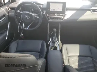 2023 Toyota Corolla Cross Hybrid S with VIN 7MUFBABG5PV008595, listed as a Copart auction lot 60002585 with 9,052 mi miles and Salvage title. Bid and sale history available at DreamBid. Image 8.