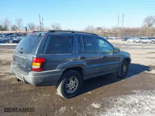 2002 Jeep Grand Cherokee Laredo with VIN 1J4GW48NX2C243282, listed as a IAAI auction lot 41362493 with 201,932 mi miles. Bid and sale history available at carsss.com. Image 4.