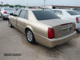 2005 Cadillac DeVille z VIN 1G6KD54Y25U129354, wystawiony jako IAAI lot #41930408 z przebiegiem 121 391 mil mil oraz . Historia ofert i sprzedaży dostępna na DreamBid. Obrazek 3.