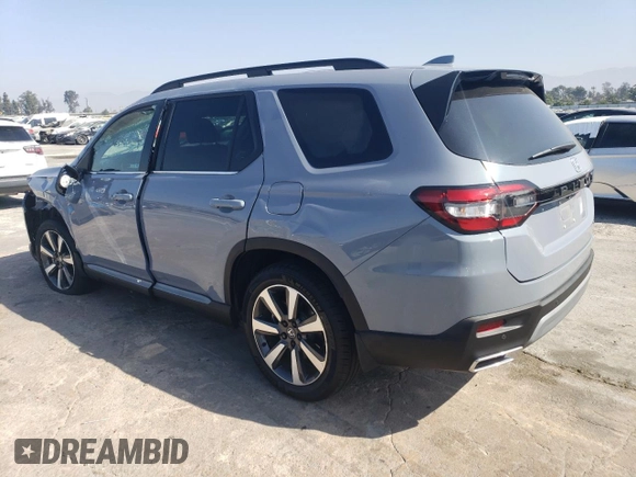 2023 Honda Pilot Touring with VIN 5FNYG2H7XPB011420, listed as a Copart auction lot 69799314 with 9,601 mi miles and Salvage Title. Bid and sale history available at DreamBid. Image 2.