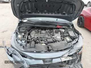 2021 Toyota Corolla Hybrid LE with VIN JTDEAMDE8MJ002711, listed as a IAAI auction lot 41498716 with 98,559 mi miles. Bid and sale history available at carsss.com. Image 10.