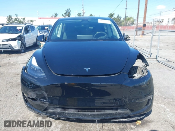 2025 Tesla Model Y Long Range with VIN 7SAYGDEE9SF278607, listed as a IAAI auction lot 41932084 with 9,667 mi miles and . Bid and sale history available at carsss.com. Image 13.