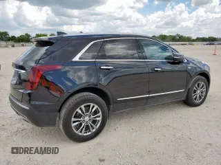 2021 Cadillac XT5 FWD Premium Luxury with VIN 1GYKNCRS0MZ100515, listed as a Copart auction lot 62856785 with 50,298 mi miles and Salvage title. Bid and sale history available at DreamBid. Image 3.
