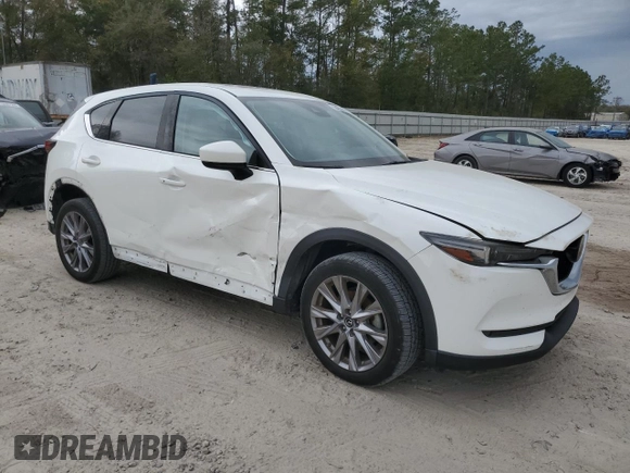 2021 Mazda CX-5 Grand Touring Reserve with VIN JM3KFBAY5M0320404, listed as a Copart auction lot 50405075 with 32,596 mi miles and Salvage Title. Bid and sale history available at carsss.com. Image 4.