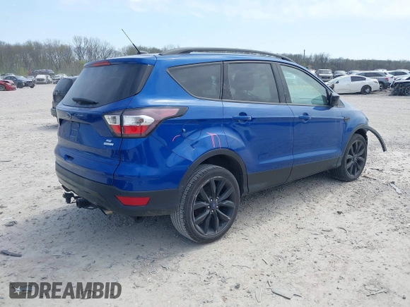 2017 Ford Escape SE with VIN 1FMCU0G94HUE90206, listed as a IAAI auction lot 42069904 with 86,883 mi miles. Bid and sale history available at carsss.com. Image 4.