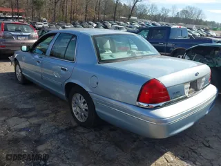 2005 Ford Crown Victoria LX with VIN 2FAFP74W65X135964, listed as a IAAI auction lot 41271175 with 82,494 mi miles. Bid and sale history available at carsss.com. Image 3.