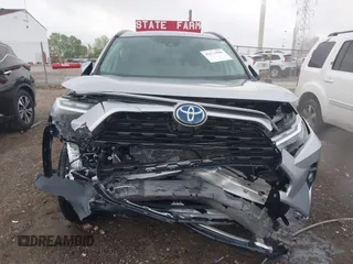 2024 Toyota RAV4 Hybrid XLE Premium z VIN 4T3B6RFV2RU151316, wystawiony jako IAAI lot #42171500 z przebiegiem 4 801 mil mil oraz . Historia ofert i sprzedaży dostępna na DreamBid. Obrazek 12.