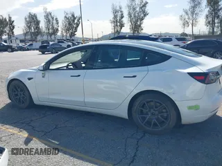 2023 Tesla Model 3 with VIN 5YJ3E1EA8PF398110, listed as a IAAI auction lot 41692006 with 112,699 mi miles and . Bid and sale history available at carsss.com. Image 14.