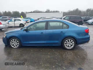 2015 Volkswagen Jetta Sedan 1.8T SE with VIN 3VWD17AJ7FM233634, listed as a IAAI auction lot 41942329 with 128,996 mi miles. Bid and sale history available at carsss.com. Image 14.