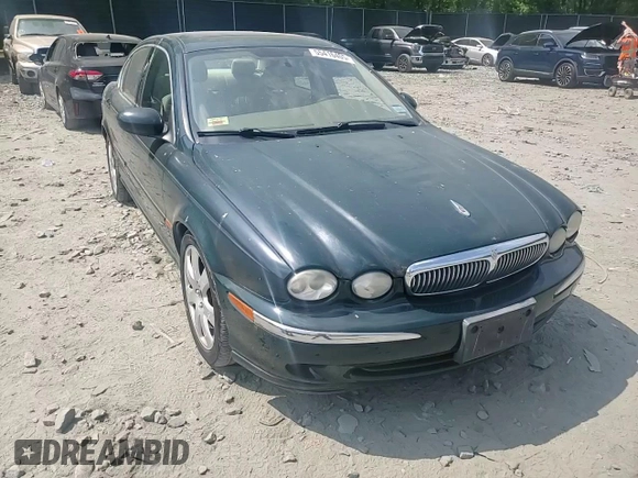 2004 Jaguar X-Type with VIN SAJEA51C64WE17722, listed as a Copart auction lot 55416405 with 89,047 mi miles and Salvage Title. Bid and sale history available at DreamBid. Image 13.