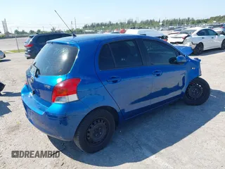 2009 Toyota Yaris with VIN JTDKT903X95257701, listed as a IAAI auction lot 41796420 with 86,953 mi miles. Bid and sale history available at carsss.com. Image 4.